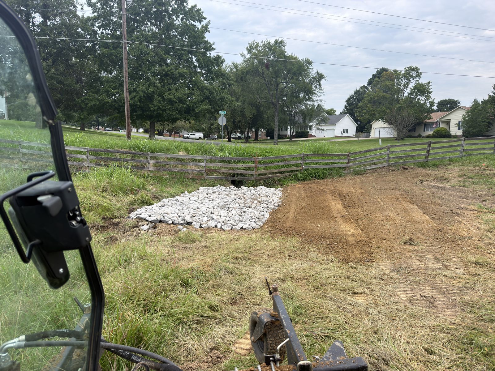 Rip-rap installed at a culvert and washout filled and regraded for drainage control in Western Kentucky