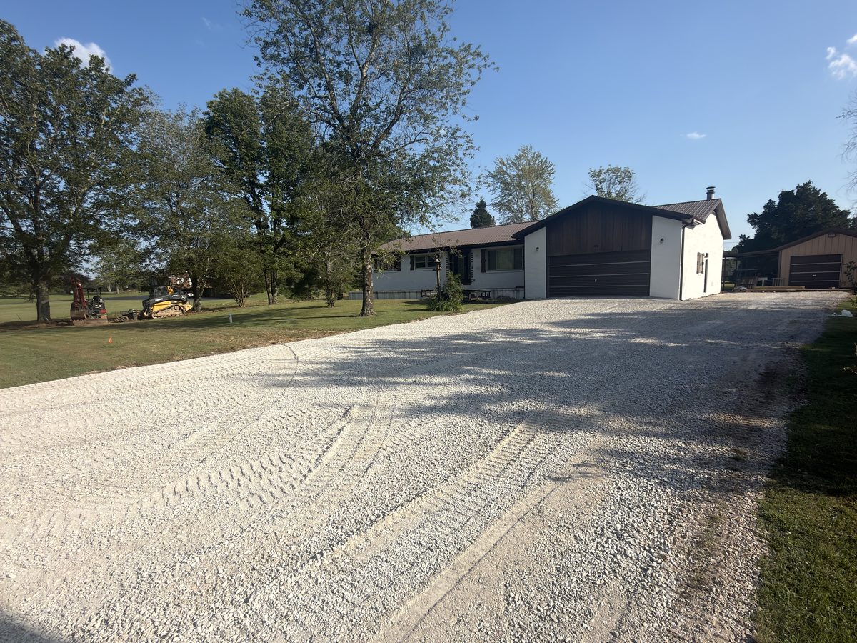 Gravel driveway widened and recrowned with fresh crushed stone in Western Kentucky